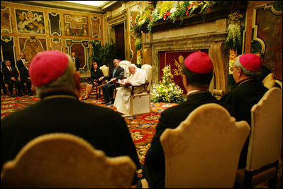 The President and Mrs. Bush listen to statements made by Pope John Paul II during their June 2004 visit to Rome.