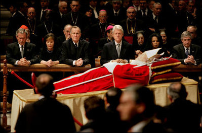 Pictured from left, President George W. Bush, Laura Bush, former President George H. W. Bush, former President Bill Clinton, Secretary of State Condoleezza Rice and White House Chief of Staff Andy Card pay their respects to Pope John Paul II as he lies in state in St. Peter's Basilica at the Vatican Wednesday, April 6, 2005.