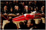Pictured from left, President George W. Bush, Laura Bush, former President George H. W. Bush, former President Bill Clinton, Secretary of State Condoleezza Rice and White House Chief of Staff Andy Card pay their respects to Pope John Paul II as he lies in state in St. Peter's Basilica at the Vatican Wednesday, April 6, 2005.