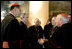 President George W. Bush greets U.S.-based Roman Catholic Cardinals during a reception Thursday, April 7, 2005, in Rome at Villa Taverna, the residence of Mel Sembler, U.S. Ambassador to Italy. From left are: Roger Cardinal Mahony, archbishop of Los Angeles; President Bush; Francis Cardinal George, archbishop of Chicago; Justin Cardinal Rigali, archbishop of Philadelphia, and William Cardinal Keeler, archbishop of Baltimore.