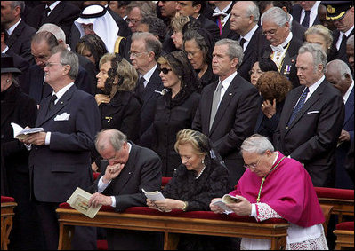 President George W. Bush and Laura Bush attend funeral services Friday, April 8, 2005, for the late Pope John Paul II in St. Peter's Square. The funeral is being called the largest of its kind in modern history.