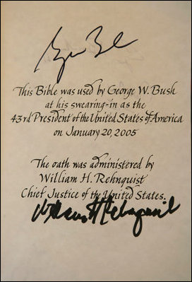 A page of the President's family bible is signed by Supreme Court Chief Justice Rehnquist. It states, 'This Bible was used by George W. Bush at his swearing-in as 43rd President of the United States of America on January 20, 2005. The oath was administered by William H. Rehnquist Chief Justice of the United States.' White House photo by Eric Draper