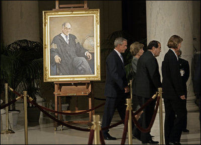 President George W. Bush and Laura Bush walk with Justice Antonin Scalia and Sally Rider, the Chief Justice's assistant, after viewing a portrait of Chief Justice William Rehnquist as his body lies in repose in the Great Hall of the U.S. Supreme Court Tuesday, Sept. 6, 2005. White House photo by Eric Draper