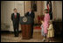 President George W. Bush announces Judge John G. Roberts as the President's nominee for Supreme Court Associate Justice, July 19, 2005 in the East Room of the White House. Roberts family members: wife, Jane Marie Sullivan Roberts; son, Jack, 4, and daughter, Josephine (Josie), 5, are seen at right.