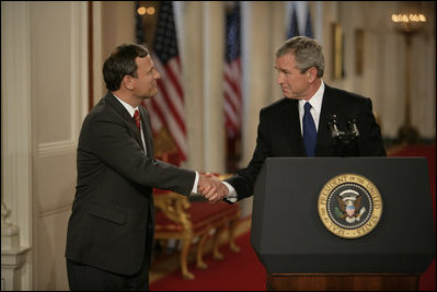 President George W. Bush shakes hands with his Supreme Court Justice Nominee John Roberts after his remarks on the State Floor of the White House, Tuesday evening, July 19, 2005.