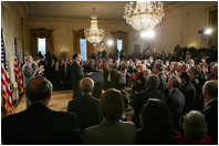 President George W. Bush, left, listens as newly confirmed U.S. Supreme Court Justice Samuel Alito addresses an audience, Tuesday, Feb. 1, 2006 in the East Room of the White House, prior to being sworn-in by U.S. Supreme Court Chief Justice John Roberts.