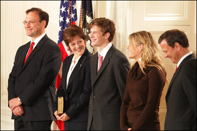 U.S. Supreme Court Justice Samuel A. Alito is seen, Tuesday, Feb. 1, 2006 in the East Room of the White House, with his wife, Martha-Ann, their son Phil, daughter, Laura, and U.S. Supreme Court Chief Justice John Roberts prior to being sworn-in.