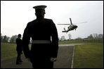 President George W. Bush arrives aboard Marine One at Hillsborough Castle in Northern Ireland, Monday, April 7, 2003.