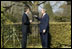 President George W. Bush and British Prime Minister Tony Blair talk alone in the gardens of Hillsborough Castle near Belfast, Northern Ireland, Tuesday, April 8, 2003. 