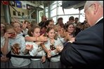 Vice President Dick Cheney shakes hands with students in New Orleans, La., after touring the National D-Day Museum with his wife Lynne Wednesday, April 9, 2003. 