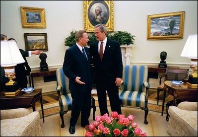 President George W. Bush talks with President Rudolf Schuster of the Slovak Republic in the Oval Office Wednesday, April 9, 2003. A member of the coalition bringing freedom to Iraq, Slovakia is contributing a nuclear/biological/chemical weapons team that is based in Kuwait.