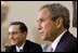 President George W. Bush and President of Colombia Alvaro Uribe take questions from the press in the Oval Office Wednesday, April 30, 2003. 