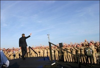 The President acknowledges sailors after addressing the nation from the flight deck of the USS Abraham Lincoln May 1, 2003.