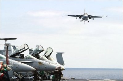 President George W. Bush approached the flight deck of the USS Abraham Lincoln in a S-3B Viking jet Thursday, May 1, 2003. 