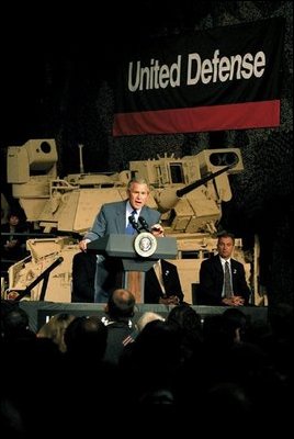 President George W. Bush addresses employees at United Defense Industries in Santa Clara, Calif., Friday, May 2, 2003. The defense company produces vehicles and technology that is being used by soldiers in Iraq, including the Bradley Fighting Vehicle and the Hercules Recovery Vehicle.