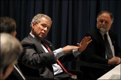 President George W. Bush talks with small business owners and employees during a roundtable discussion at the Robinson Center in Little Rock, Ark., Monday, May 5, 2003.