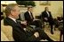 During a meeting with Secretary of Defense Donald Rumsfeld, President George W. Bush announces L. Paul Bremer, center, as the presidential envoy to Iraq in the Oval Office Tuesday, May 6, 2003. "He's a man of enormous experience; a person who knows how to get things done; he's a can-do type person," said the President of the former ambassador.