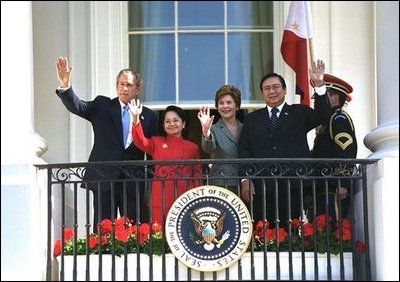 At the end of the ceremony, President Bush, Mrs. Bush, President Arroyo and Mr. Arroyo wave from the Truman Balcony. 