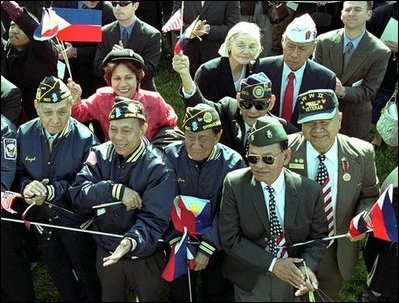 World War II Filipino-American veterans cheer for Presidents Bush and Arroyo. "I am proud of the contributions that Filipinos and Filipino Americans make to the American economy and society," said President Arroyo in her remarks. "In a quiet, but equally substantive way, we can compare it to the contribution made by Philippine World War II veterans to the defense of our common freedom and security." 
