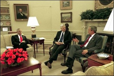 President George W. Bush meets with Senator John Danforth, the President's Special Envoy to the Sudan, center, and Secretary of State Colin Powell in the Oval Office Wednesday, May 21, 2003. 