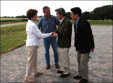 President George W. Bush and Laura Bush greet Japanese Prime Minister Junichiro Koizumi at their Texas ranch Thursday afternoon, May 22, 2003.