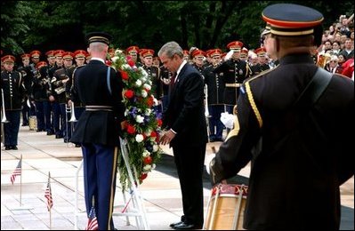 President George W. Bush visits Arlington National Cemetery on Memorial Day and lays a wreath at the Tomb of the Unknown Soldier.
