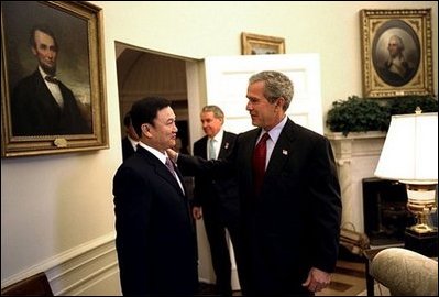 President George W. Bush meets with the Prime Minister Thaksin Shinawatra of Thailand in the Oval Office Tuesday, June 10, 2003. 