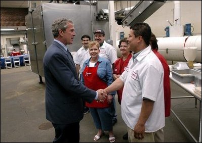 President George W. Bush greets employees of Andrea Foods in Orange, N.J., Monday, June 16, 2003. 