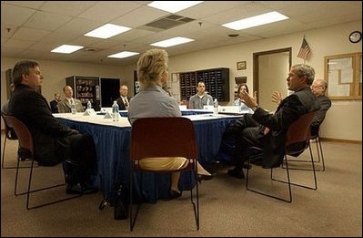 President George W. Bush meets with local business persons in Fridley, Minn., Thursday, June 19, 2003.