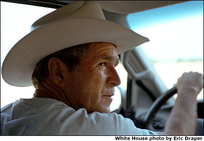 Back in the America's Heartland, President Bush tours along his ranch on dusty Texas roads on a hot summer afternoon Aug. 7. White House Photo by Eric Draper.