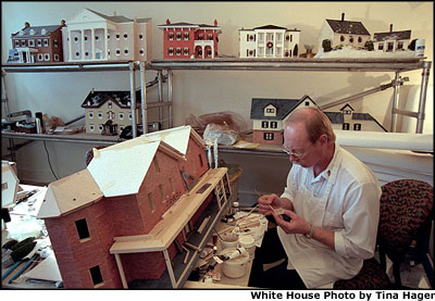 White House Chief Plumber Gary Williams works on a model of President Rutherford B. Hayes' home as part of the White House Christmas decorations. Keeping with this year's theme of 