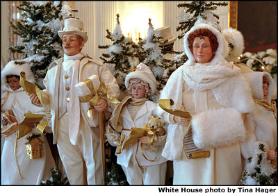 Situated on the center of the State Dining Room table, seven carolers sing the joy of the Christmas season. White House staff made the dolls, and their clothing, for this year’s holiday celebration. White House photo by Tina Hager