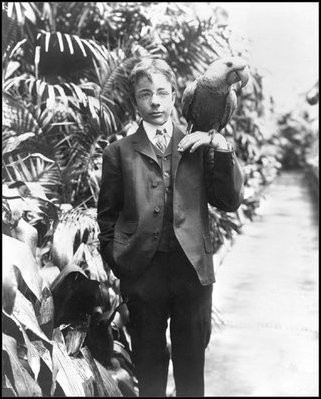 Teddy Roosevelt, Jr., son of President Theodore Roosevelt (1901-09), poses with his blue macaw, Eli Yale, June 17, 1902. 