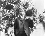 Teddy Roosevelt, Jr., son of President Theodore Roosevelt (1901-09), poses with his blue macaw, Eli Yale, June 17, 1902. 