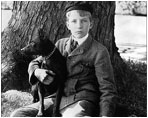 Kermit Roosevelt sits with his terrier, Jack, on the White House lawn in 1902.