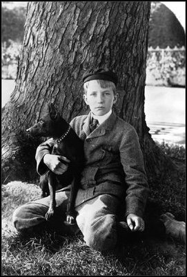 Kermit Roosevelt sits with his terrier, Jack, on the White House lawn in 1902. 