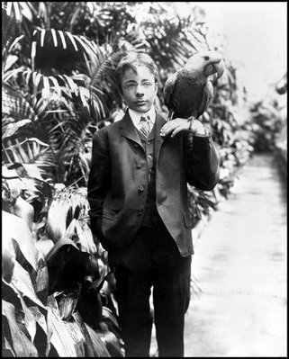 Teddy Roosevelt, Jr. holds Eli Yale, one of his two blue macaws, June 17, 1902.