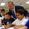 Photo of President Bush with children at an elementary school in Connecticut.