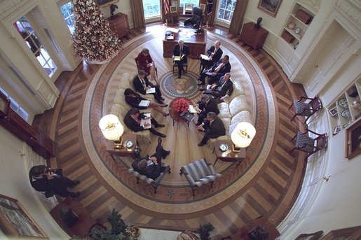 Pictures is a birdseye view of a meeting in the Oval Office. White House photo by Paul Morse.