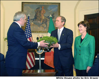 Prime Minister Ahern presents a shamrock plant to the White House. White House photo by Eric Draper.