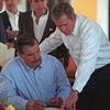 President Bush signs a joint statement with the President of Mexico.