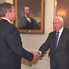 President Bush shakes hands with the Prime Minister of Israel.