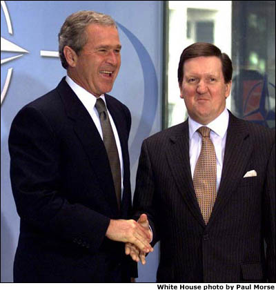 NATO Secretary-General George Robertson greets President George W. Bush at NATO headquarters in Brussels, Belgium on June 13, 2001. White House photo by Paul Morse