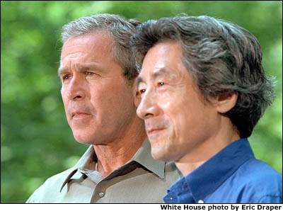 President Bush and Prime Minister Koizumi of Japan discuss the relationship between the U.S. and Japan at a meeting at Camp David. White House photo by Eric Draper.