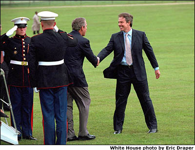 British Prime Minister Tony Blair welcomes President Bush to Chequers in Halton, England. Like Camp David, which Mr. Blair visited in February, Chequers is a private residence for the Prime Minister where the two leaders can talk privately. 