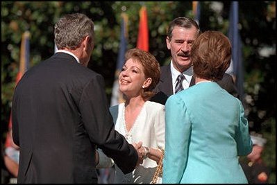 President Bush and Mrs. Laura Bush greet President Vicente Fox and his wife Mrs. Martha Sahagun during the State Arrival Ceremony.