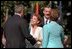 President Bush and Mrs. Laura Bush greet President Vicente Fox and his wife Mrs. Martha Sahagun during the State Arrival Ceremony.