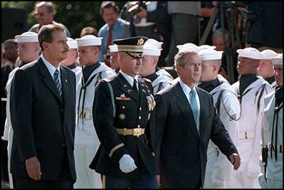 Presidents Bush and Fox review the troops during the day's ceremonies.