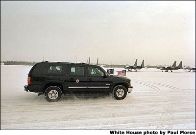 Although arriving amidst cold, blowing snow, President George W. Bush is greeted warmly at Alaska's Elmendorf Air Force Base, Saturday, Feb. 16, 2002. White House photo by Paul Morse.