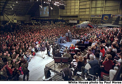 After being greeting by a loud chorus of U.S.A, U.S.A., President George W. Bush addresses an enthusiastic crowd of troops at Elmendorf Air Force Base in Alaska, Saturday, Feb. 16, 2002. White House photo by Paul Morse.